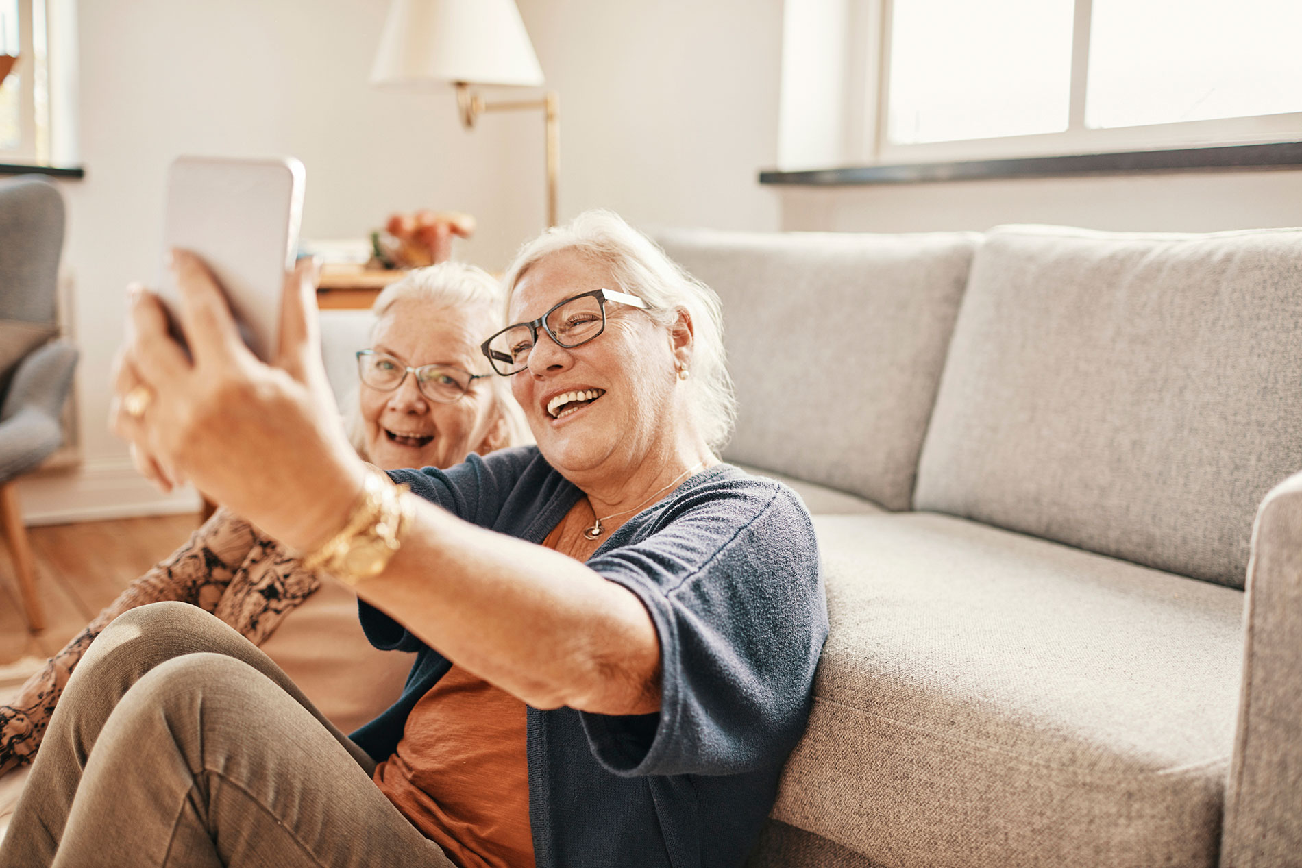 two friends enjoying their full dentures from Dieppe Denture Clinic